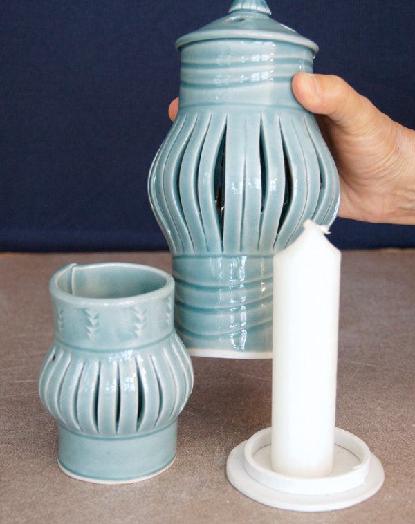 Completed lantern, showing the base with a self-supporting candle. Once the candle is lit, the lantern body is placed over the base flange.