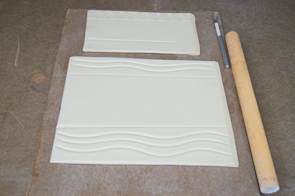 3 Add textures above and below the two impressed lines created with the dowel.