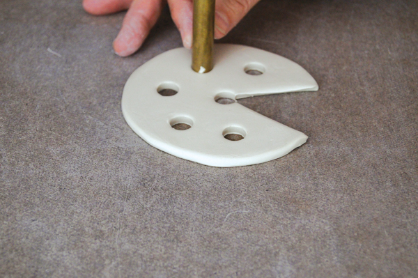 7 Punch a few additional holes of any size in the circle to serve as heat vents.