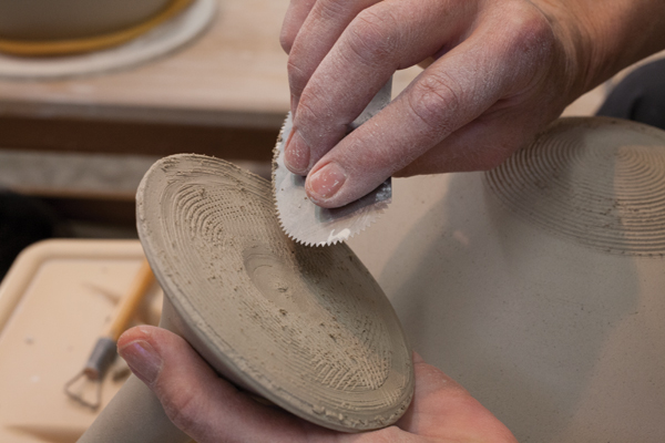 13 Add some water and use a serrated rib to score the base of the stem.