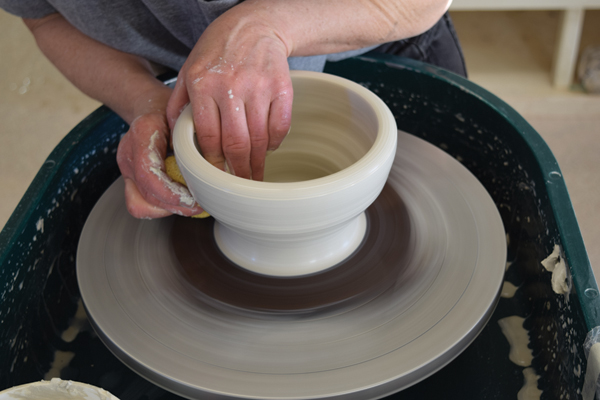 1 Center the clay and open it up, leaving a floor only ¼ inch thick and 3 inches wide. Create a well, then pull the wall up and out.