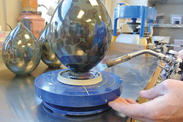 11 After the pot has cooled from the firing, heat the catcher up then remove it from the pot.