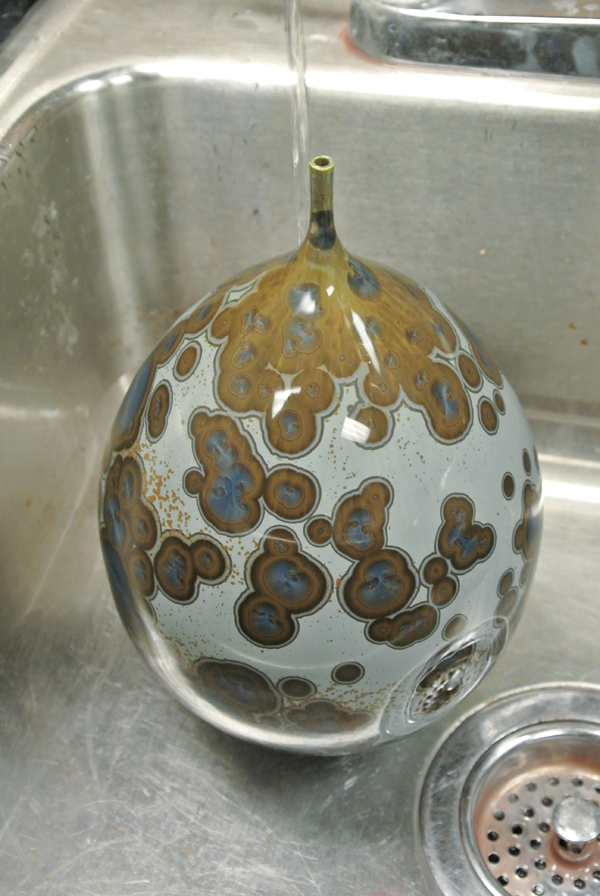 15 As the glaze leaches from the pot it leaves a skin of metal salts on the surface. These metal salts can easily be washed off.