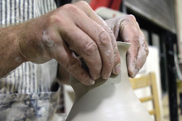 6 Stretch the spout to give it more height and lift.
