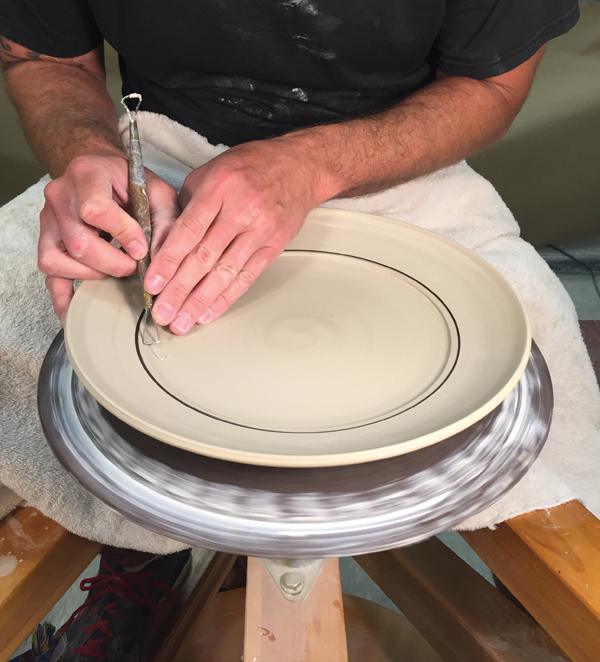 6 Turn the plate right-side up, then recenter the piece. Use a small trimming tool to refine a crisp edge for the glaze interior.