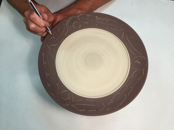 8 Lay out an image or pattern around the rim using a sharp drawing pencil or a needle tool.