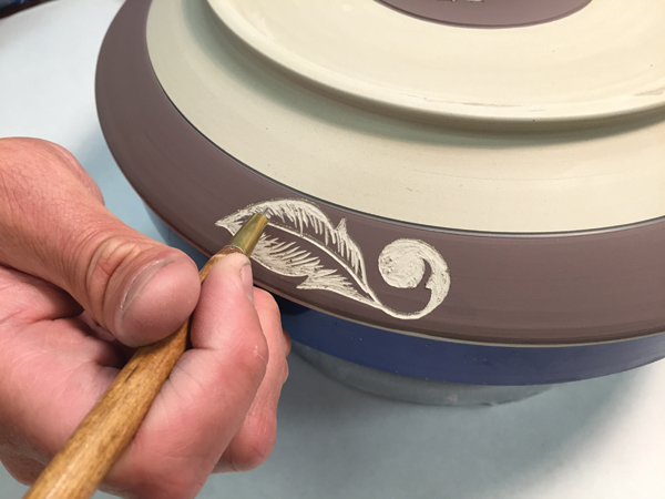11 Carving shallow, wispy strokes creates a visual mix of bare clay and underglaze, resulting in a variety of textures and shading.