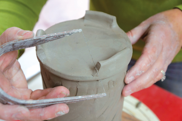 9 Cut a reverse scoop profile from the outside of each foot with a wire knife for a more pleasing negative shape.