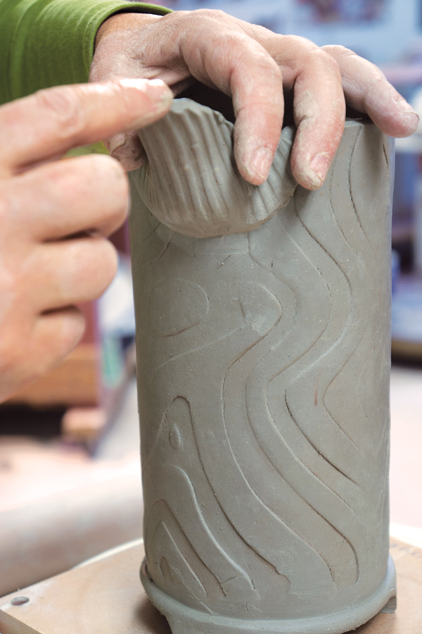 14 Shape the spout by thinning out the lip and slightly bending it downward with a wet fingertip.