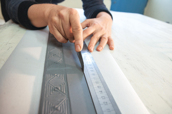 6 Cut a straight line approximately 1 inch above the top of the texture.