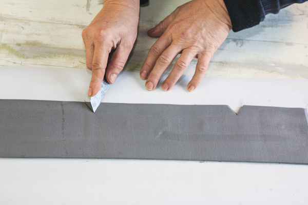 9 Establish a triangular window in the cut, the angle of the knife cuts will be the same on both ends of the triangle.
