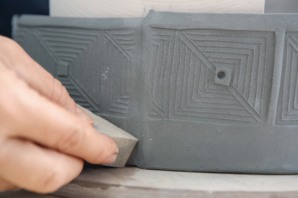 14 Smooth the seam with a soft rubber rib and a damp cosmetic sponge.