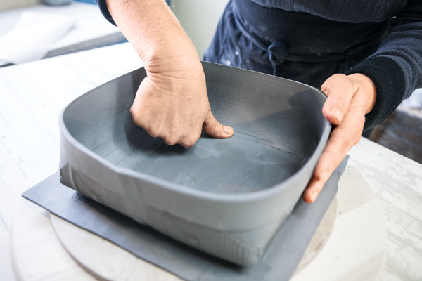 18 With your thumb and a rubber rib, attach the bowl body to the base slab.
