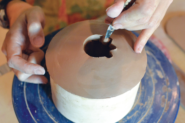 6 Loosely cut a hole in the center to match the shape of the reamer.