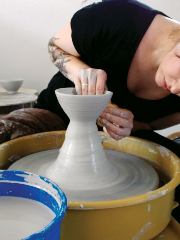 1 Throw a small bowl off the hump. Refine the shape using a rib.
