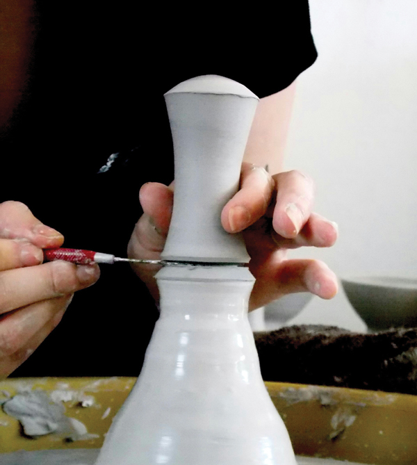 7 After you have the desired shape, cut the handle off the hump with a needle tool.