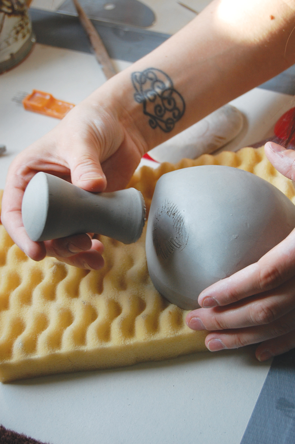 12 Smooth and refine the handle, then score and slip it onto the scoop.