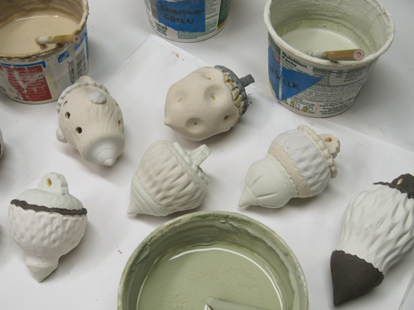 8 After the bisque firing apply either homemade and/or commercial glazes with brushes and/or by dipping. I like to layer multiple glazes to add variety and to promote glaze movement and running. I fire my ornaments to cone 6 in an electric kiln.