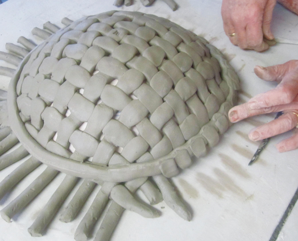 7 Smooth and compress the cut coils as you go to remove sharp edges and compress the join.