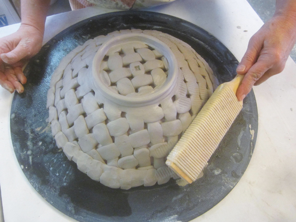 12 The paddled texture will contrast the smooth, thrown foot ring as well as the interior of the bowl, creating visual interest.