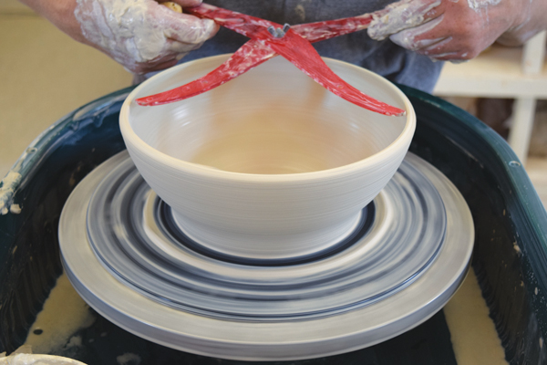5 Throw a bowl with a wide base and an almost vertical rim. The calipers should fit just inside the rim.