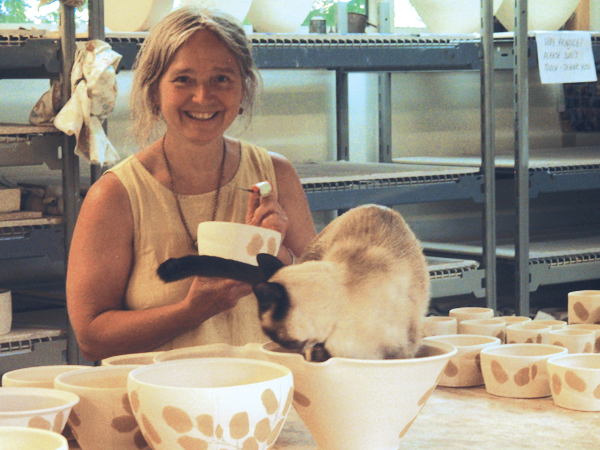 6 Cathi Jefferson working in her studio along with her cat, Hardy. Photo: Alison Tang.