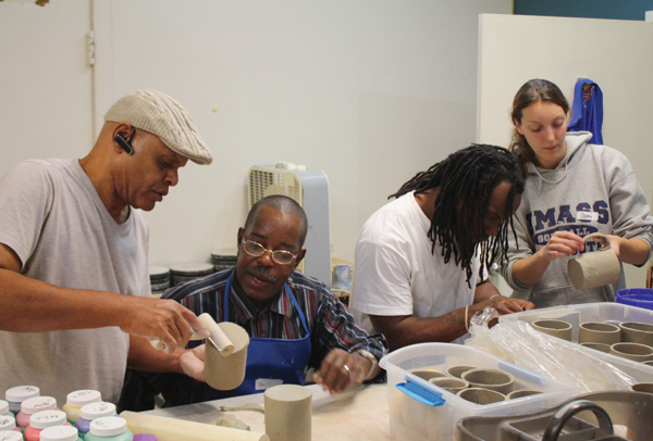 1 Instructor Herb Massie and assistant Camilla Asher demonstrate creating a smooth and even foot and handle to Tuerk House participants. 